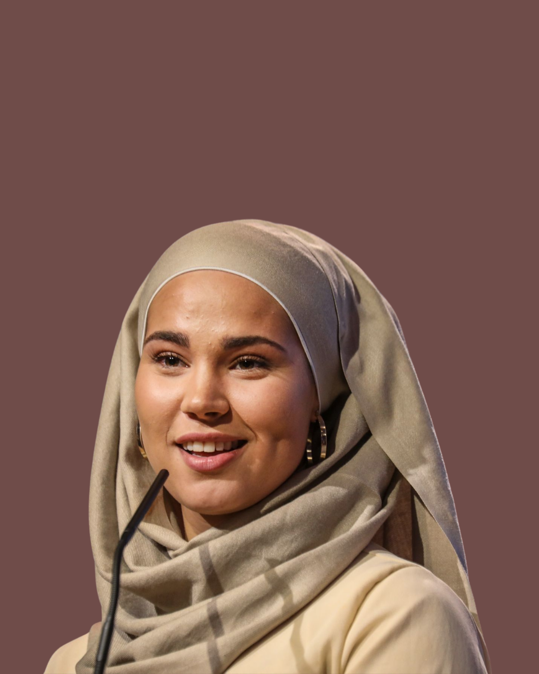 Iman Meskini speaking on stage